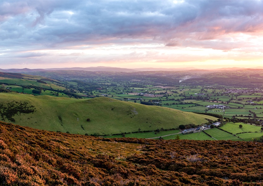 A scenic country walking path at sunset in North Wales