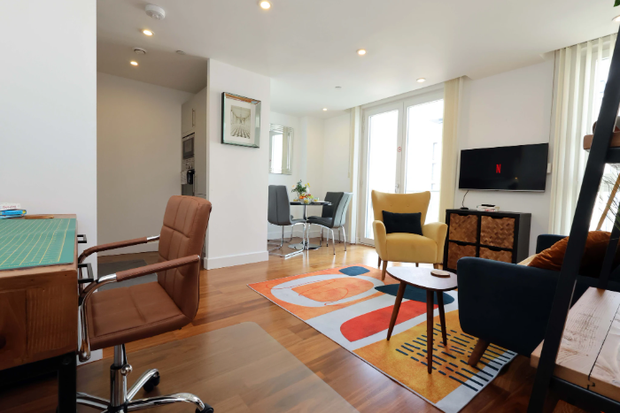Modern serviced apartment workspace and living area