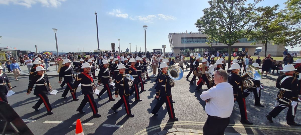 Local community performance and parade at Liverpool waterfront