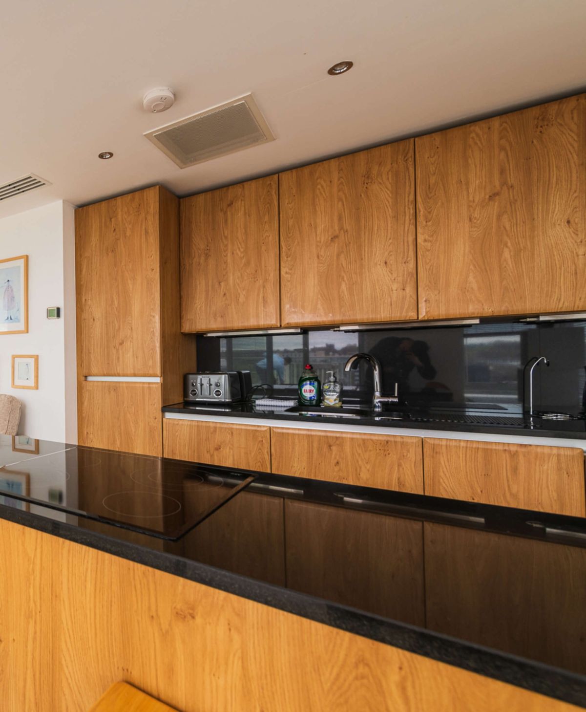 Open-plan kitchen and living room in the penthouse